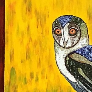 A painting of an owl on the side of a wall.
