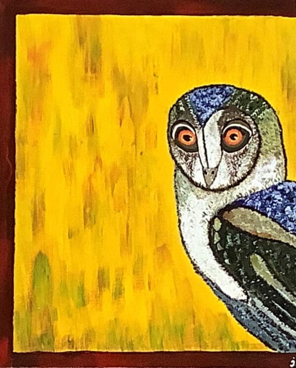 A painting of an owl on the side of a wall.