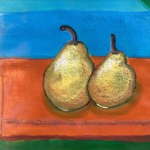 Two pears on an orange surface.